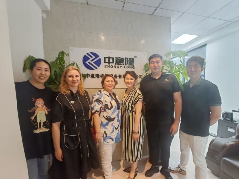 Customer Visits & Global Exhibitions 7 Customer group photo at machinery factory