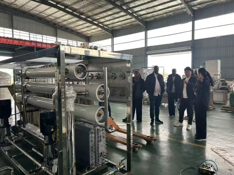Customer Visits & Global Exhibitions 6 Customer inspecting beverage production line