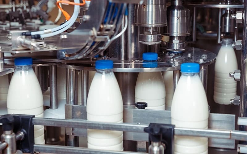Automatic aseptic bottle capping system for milk beverages