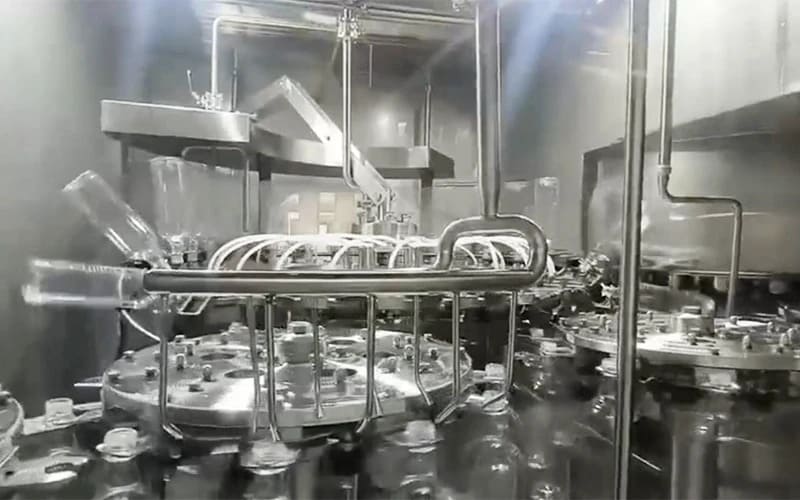 Bottle and cap sterilization system for aseptic milk filling